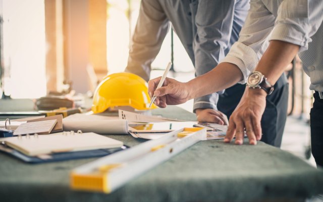 Builders looking at plans