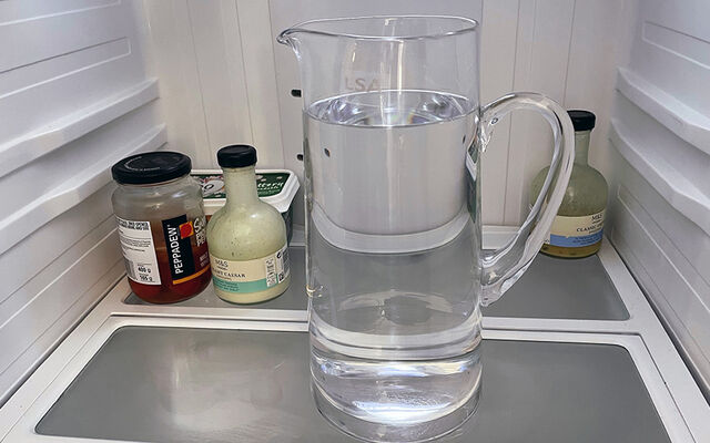 A jug of water in a fridge