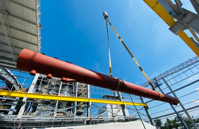 Pipe being put in place by crane